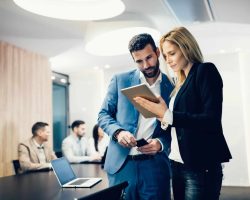 Business colleagues having meeting in conference room in modern office