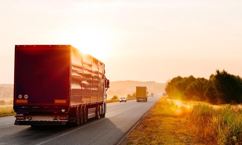 arriving-truck-road-rural-landscape-sunset