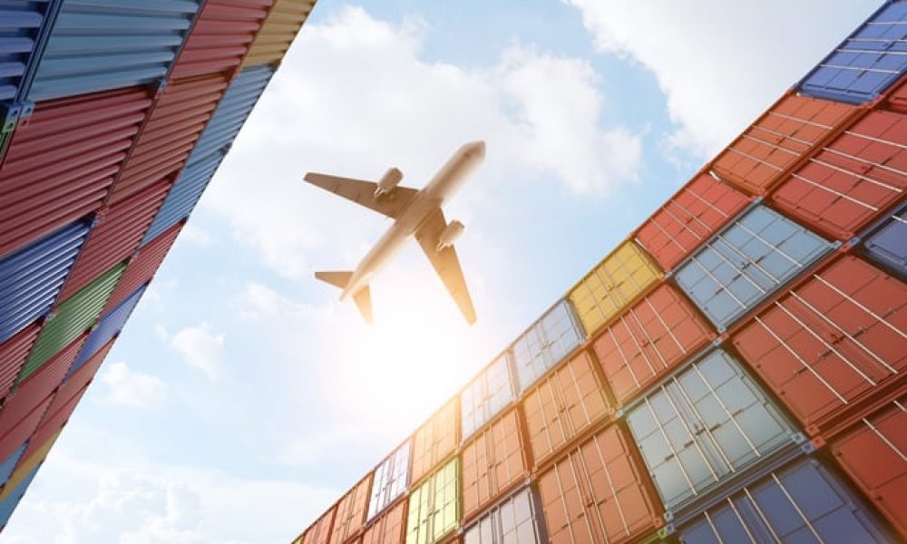 3d rendering cargo plane flying above stack of containers at container port